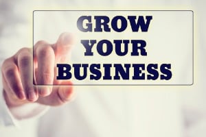 Concept of new or start up business - words Grow your business o